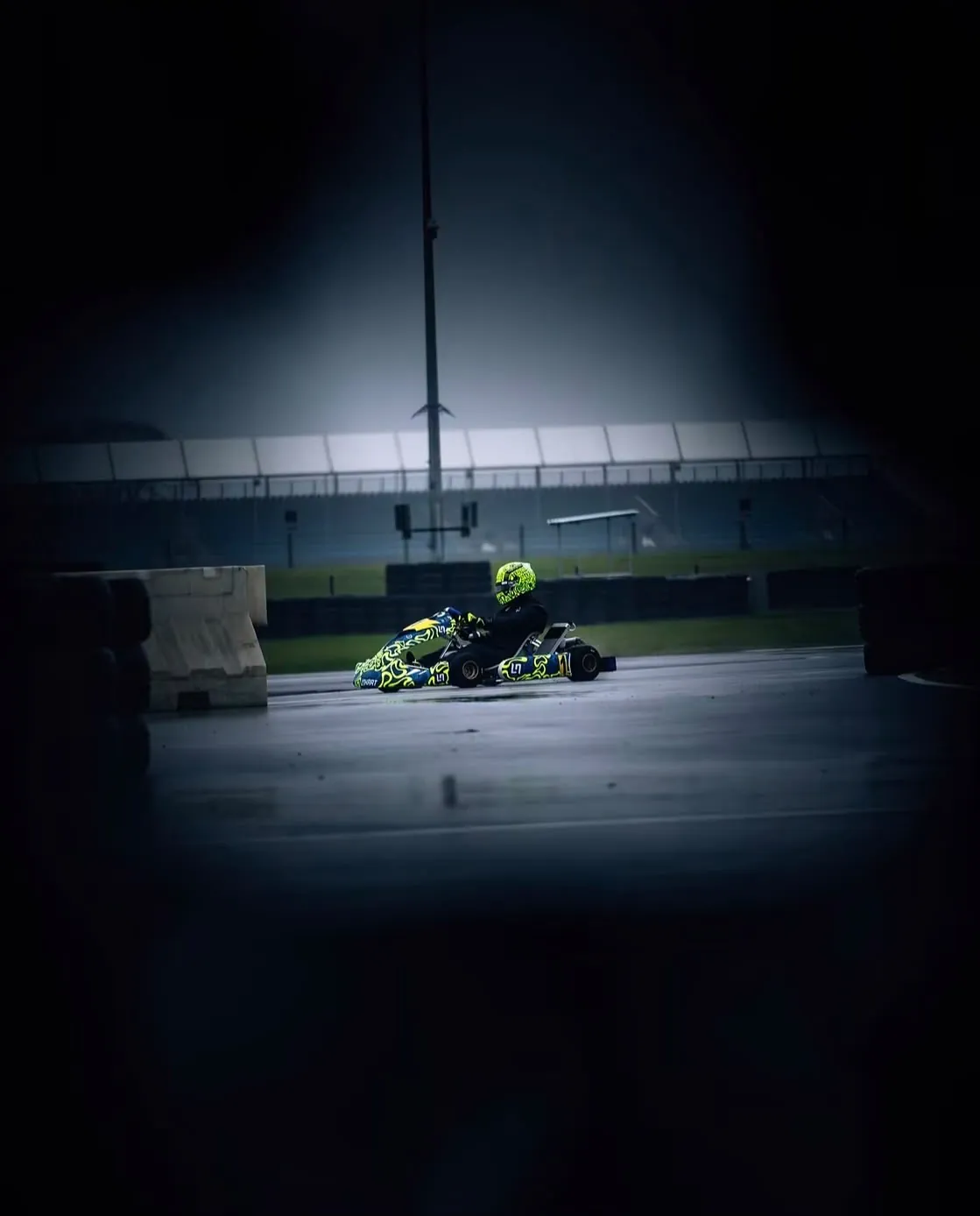 Kart on a wet circuit at night